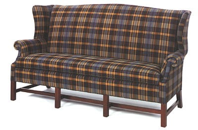 friendship upholstery orange, brown, and blue plaid couch