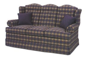 friendship upholstery orange, brown, and blue plaid couch with pillows
