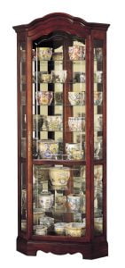 howard miller curio cabinet with multiple floral patterned pots and bowls inside