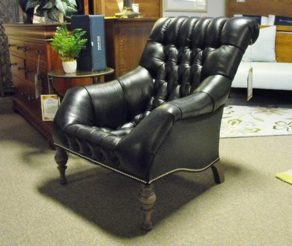 high back black leather upholstered armchair