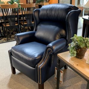 Dark blue leather armchair with metal detailing