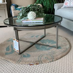 round glass coffee table with silver metal base
