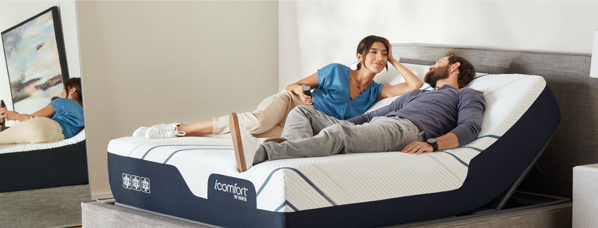 couple laying on adjustable mattress