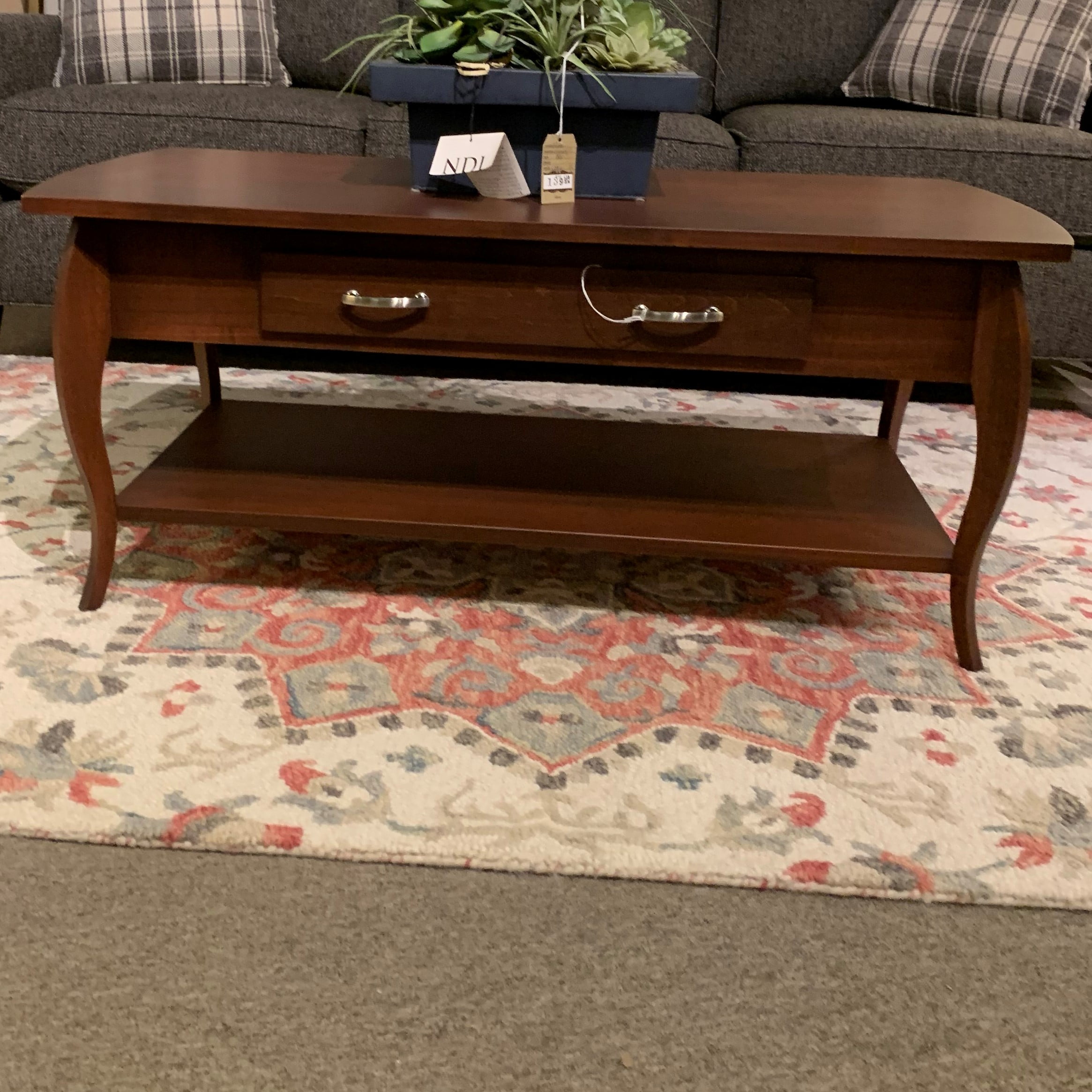 Wooden coffee table with side drawer and metal handles