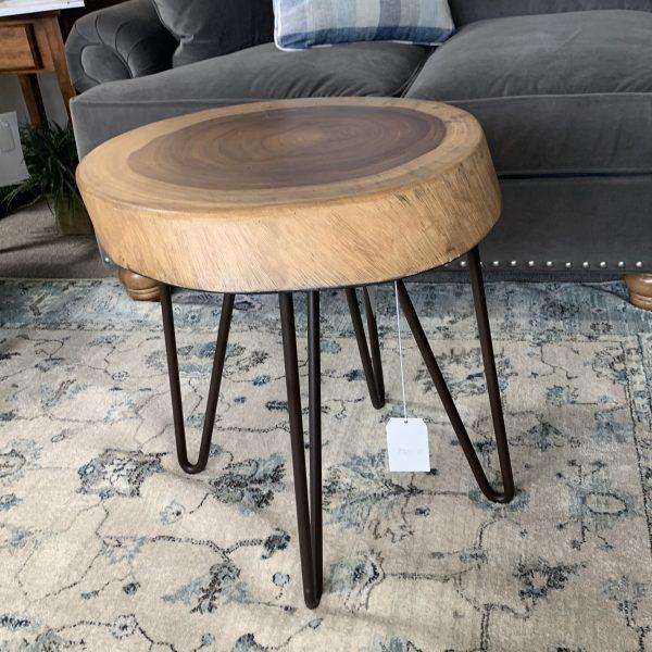 Wooden side table with growth rings in the center
