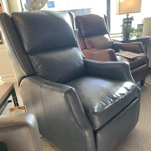 black leather recliner and brown leather armchair