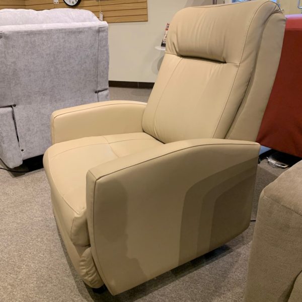 Tan, light cream leather recliner chair on a grey carpet